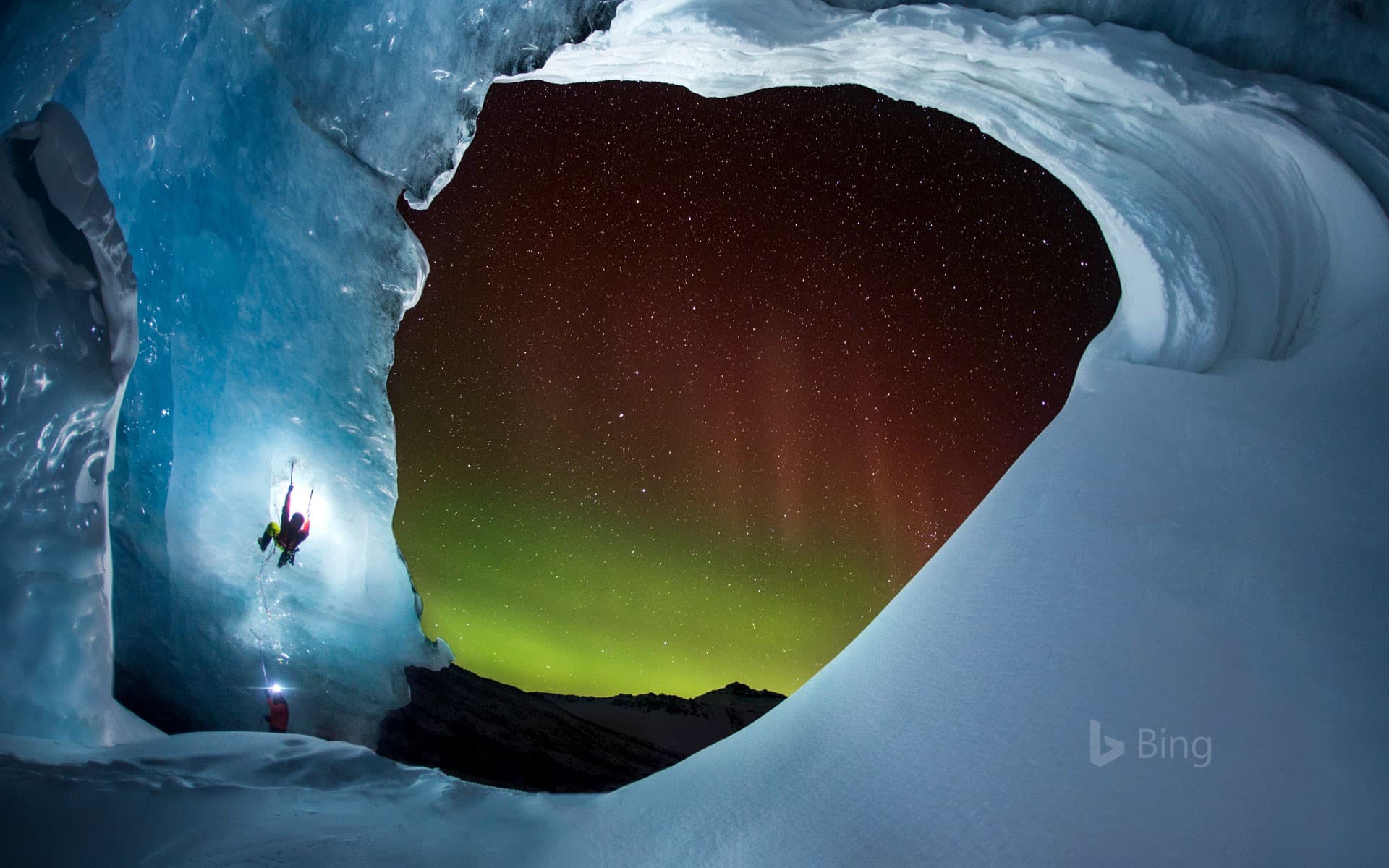 Bing Wallpaper: Climbing Athabasca Glacier in Jasper National Park, Alberta, Canada, as the aurora borealis glows