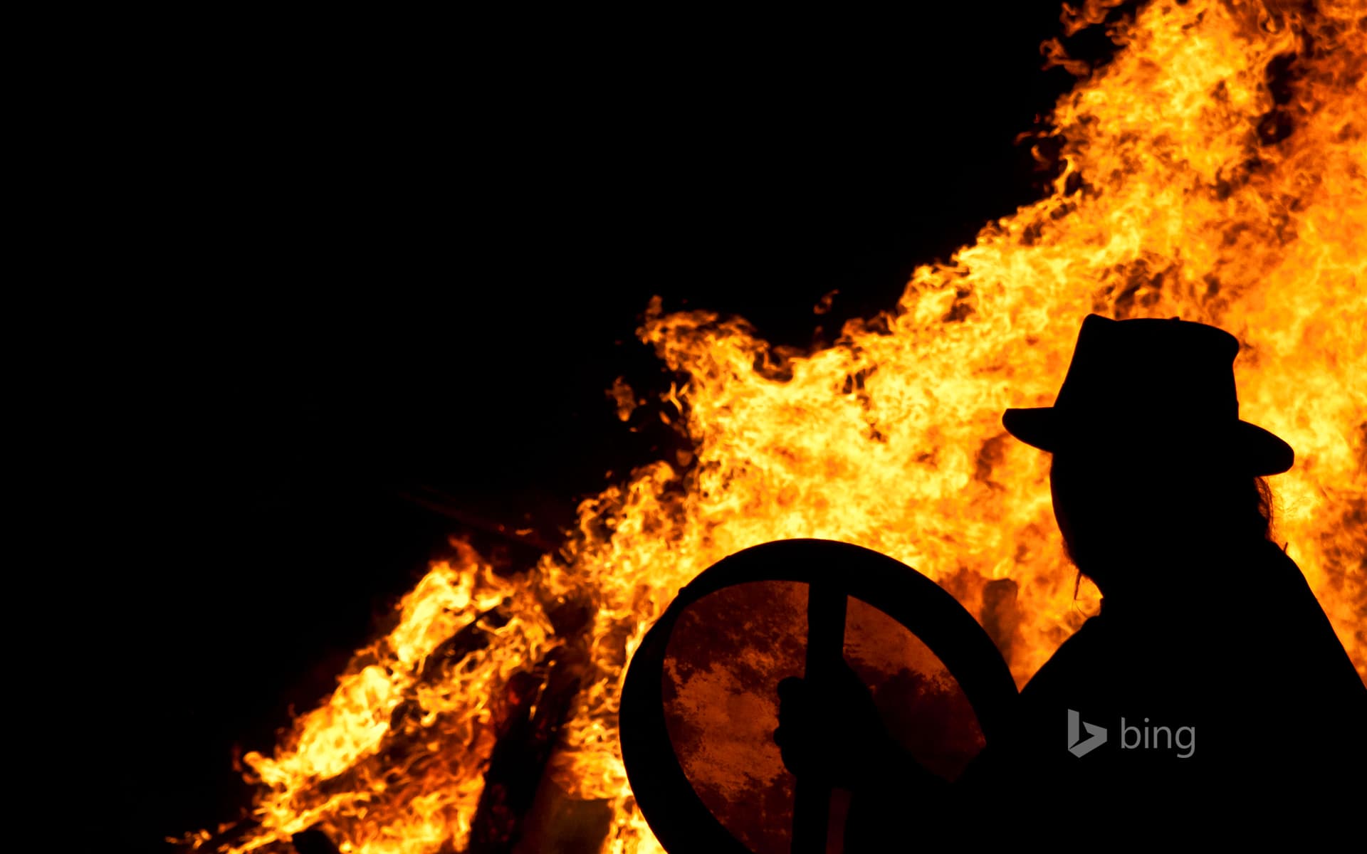 Bing Wallpaper: Drummer with a bodhran at a pagan Beltane fire ceremony