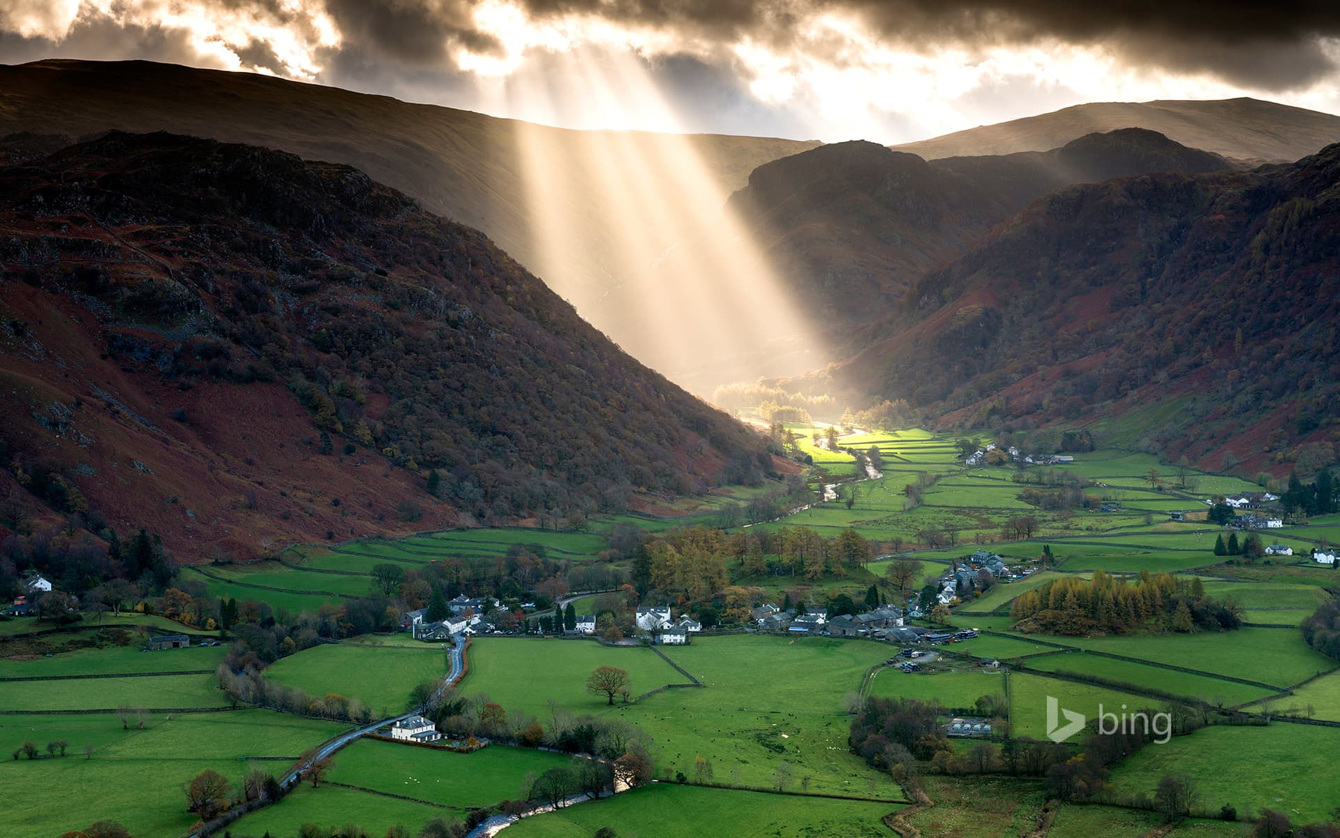 Bing Wallpaper: Shafts of light work their way across the Borrowdale valley in the English Lake District National park