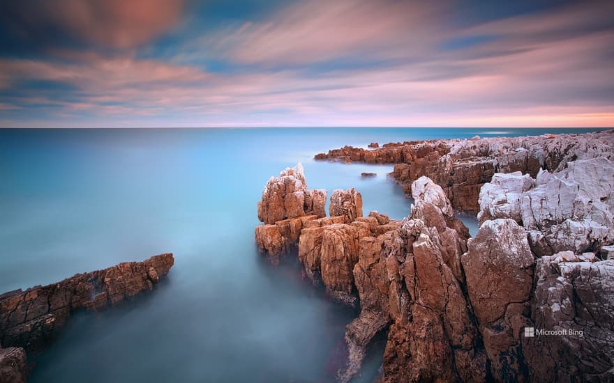 Rocks in the sea at sunset, Cap d'Antibes, Provence-Alpes-Côte d'Azur