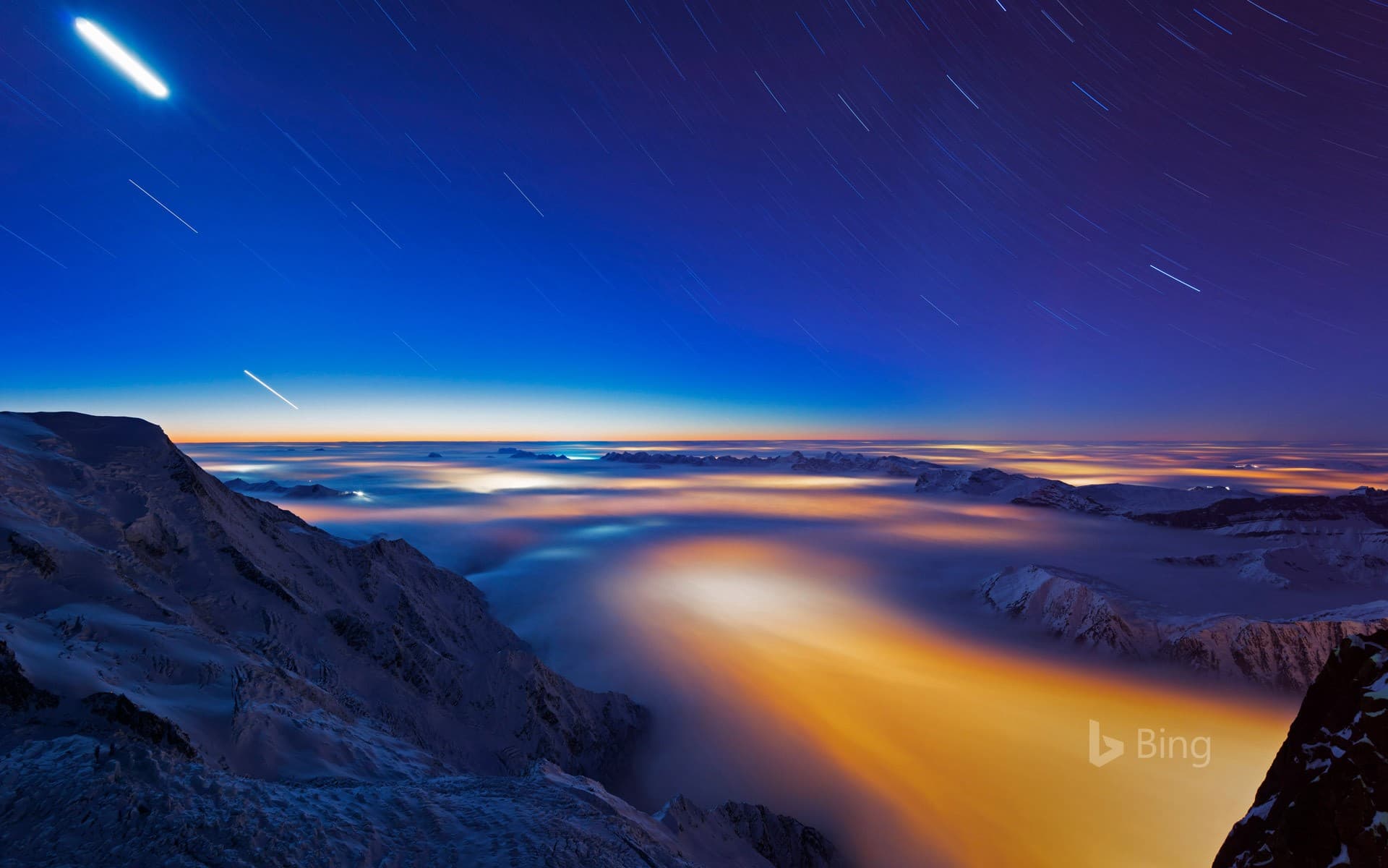 Bing Wallpaper: Sea of clouds over Chamonix Valley, France