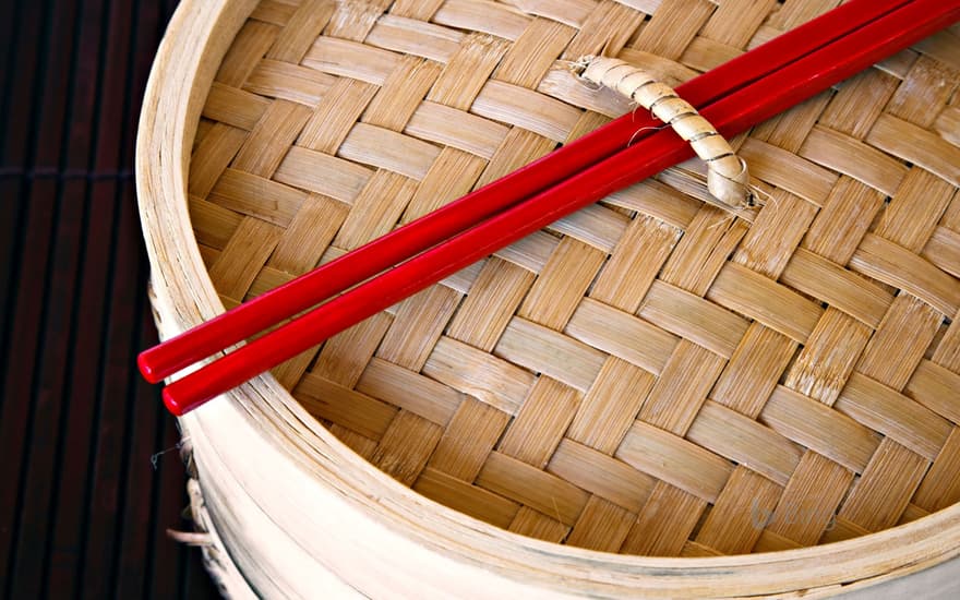Red chopsticks and steamer, China