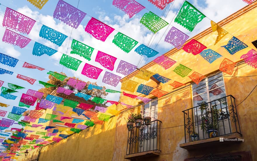 Paper flags strung over a street in San Miguel de Allende, Mexico
