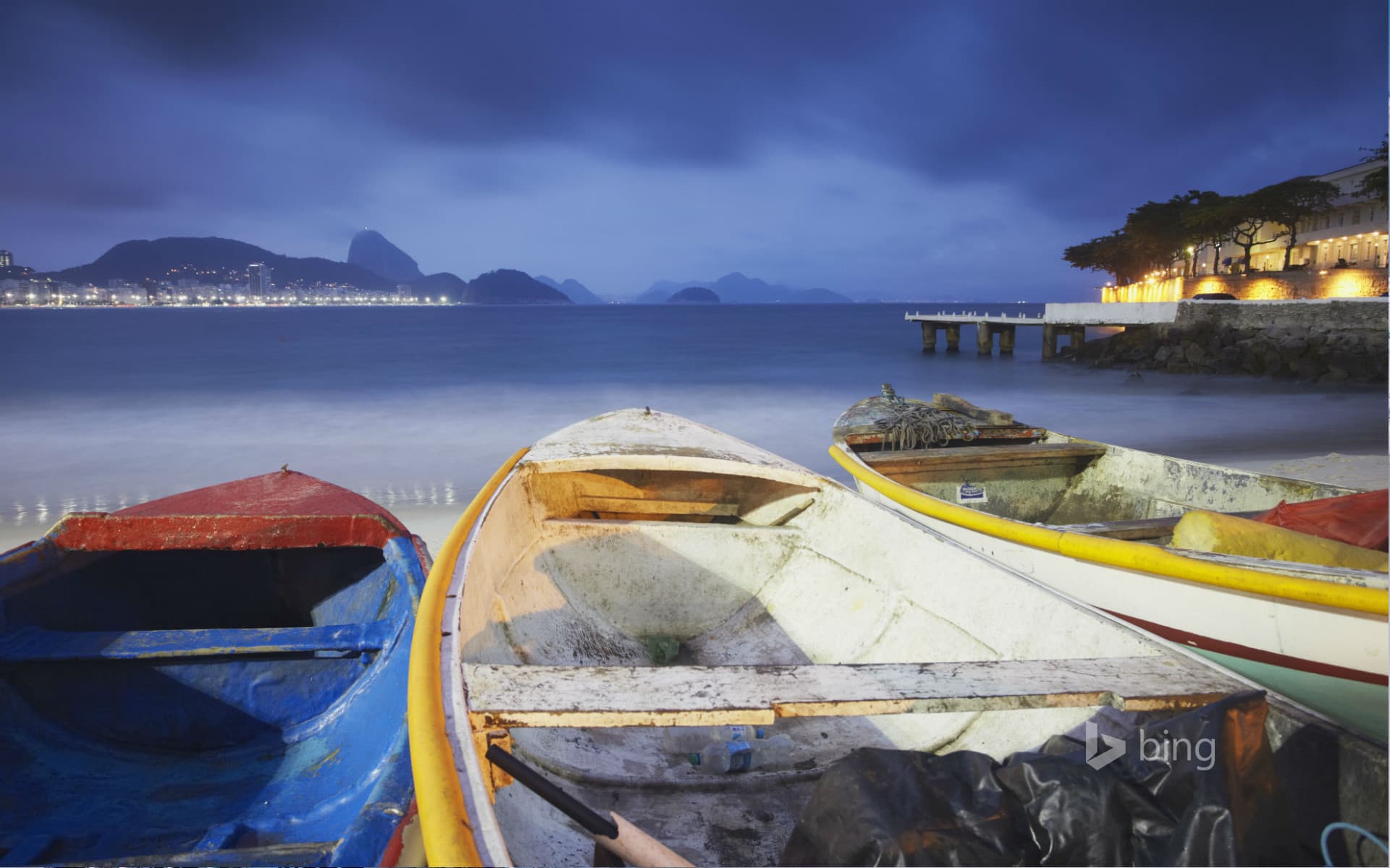 Bing Wallpaper: Fishing boats on Copacabana beach at dusk, Rio de Janeiro, Brazil
