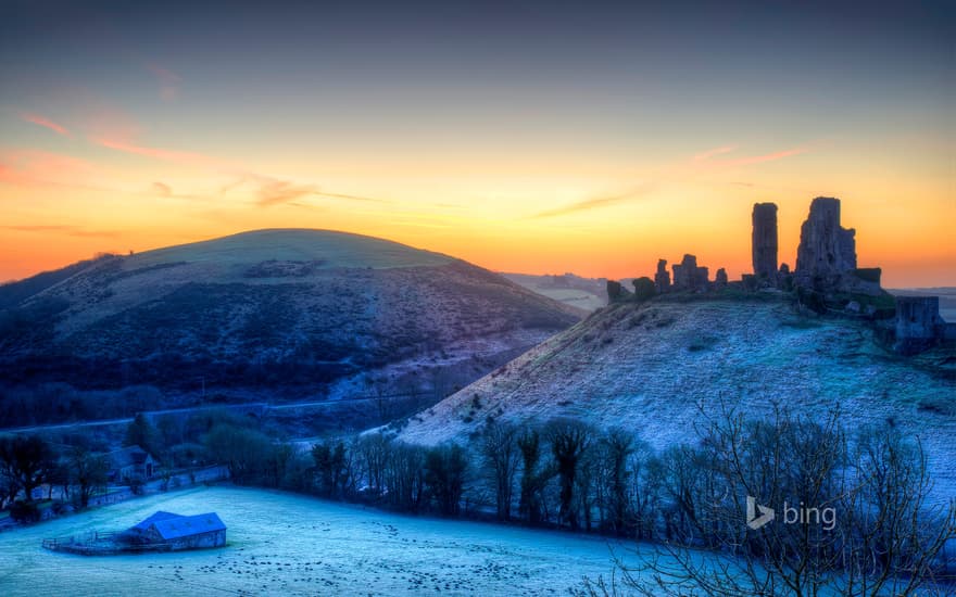 Colourful sunrise over Corfe Castle, Dorset, United Kingdom