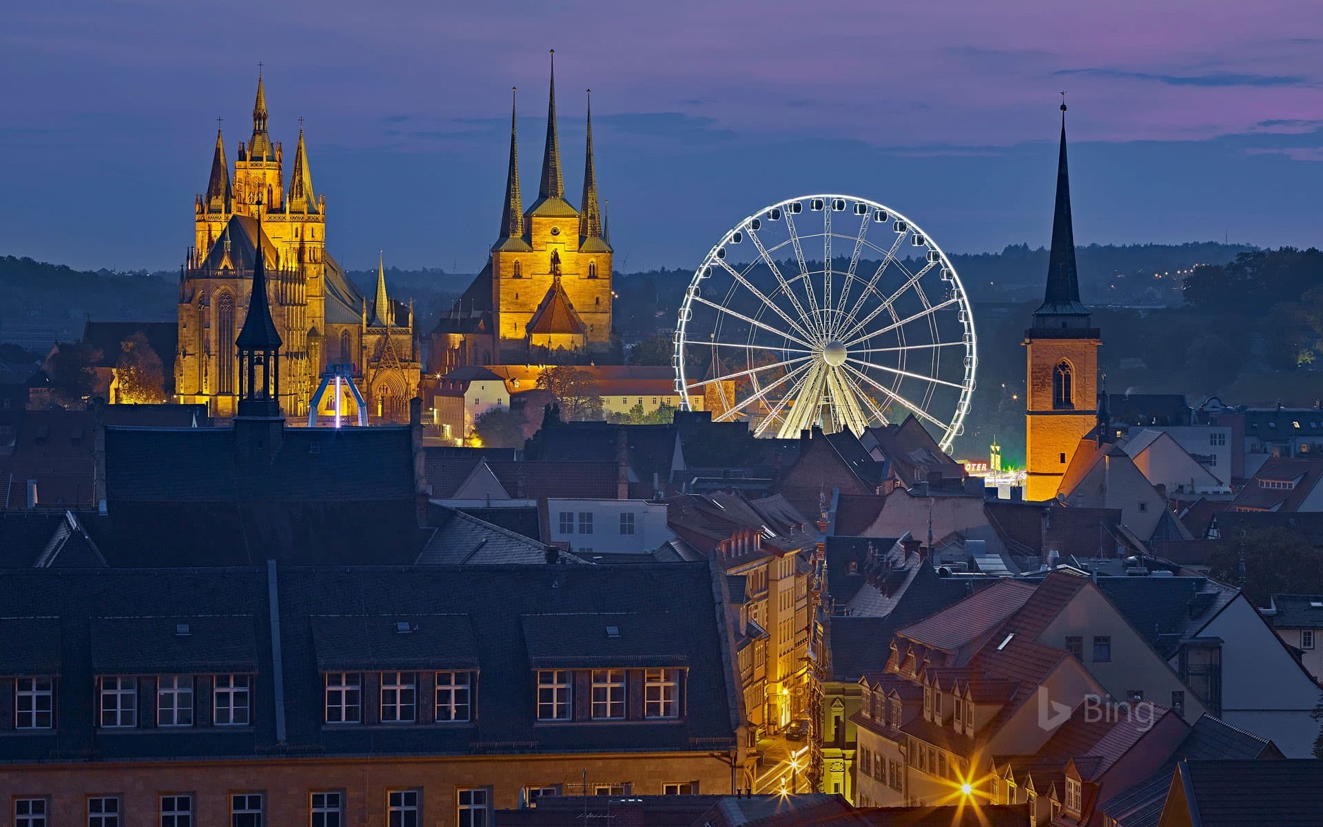 Bing Wallpaper: View of the Ferris wheel, Erfurt Cathedral and St. Severus Church during Oktoberfest in Erfurt, Germany