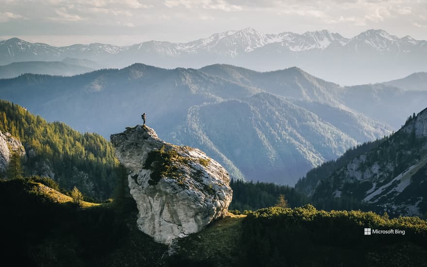 Hikers at sunrise on a mountain ridge, Gesäuse National Park, Styria, Austria