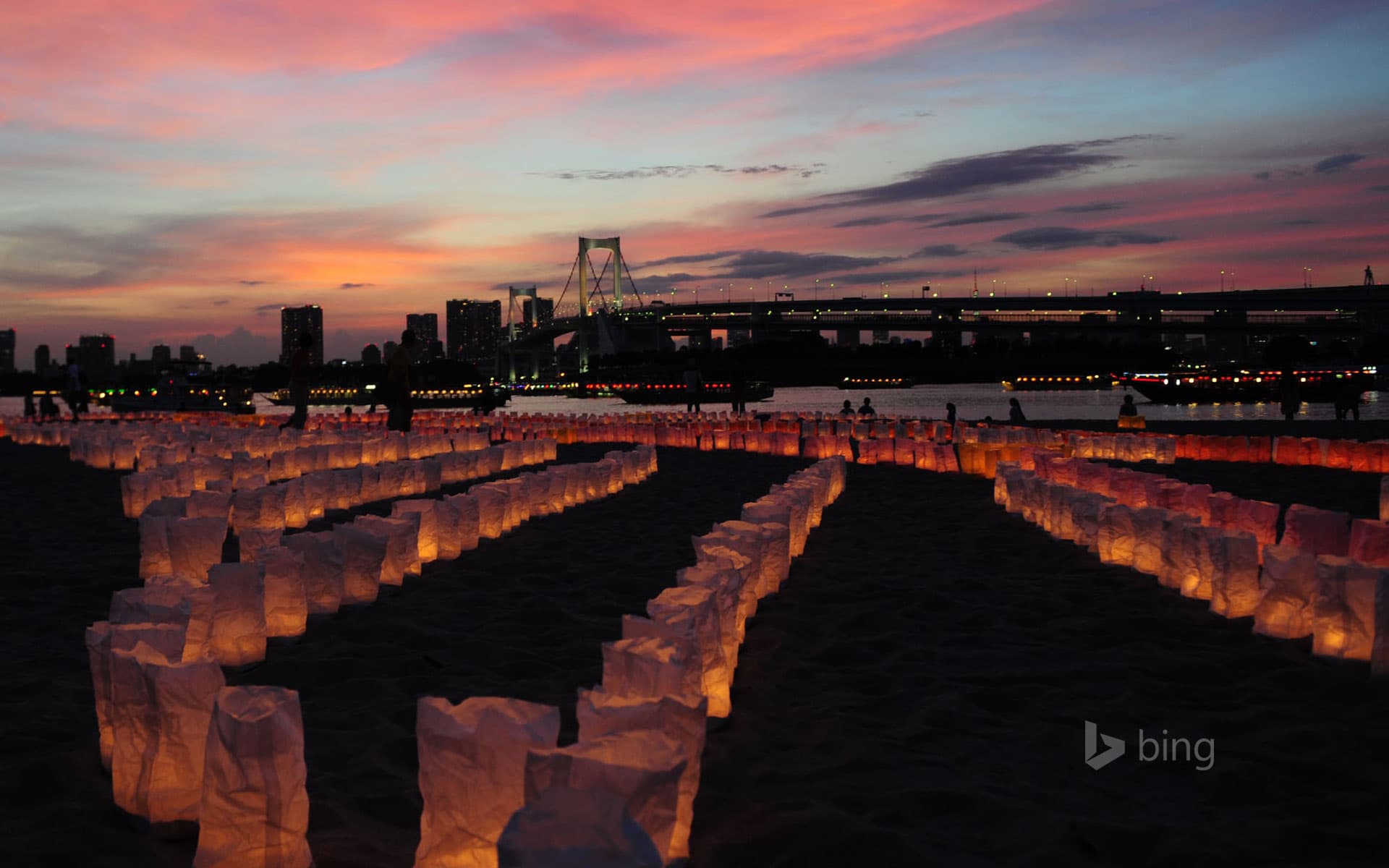Bing Wallpaper: Candles line the beach at Odaiba Marine Park for Marine Day, Tokyo, Japan