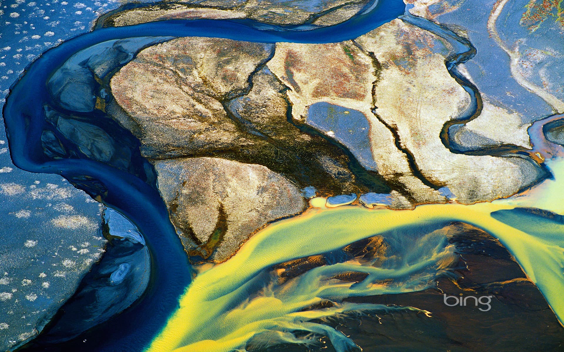 Bing Wallpaper: Aerial view of glacial ice on the River Thjorsa (Þjórsá) in southern Iceland