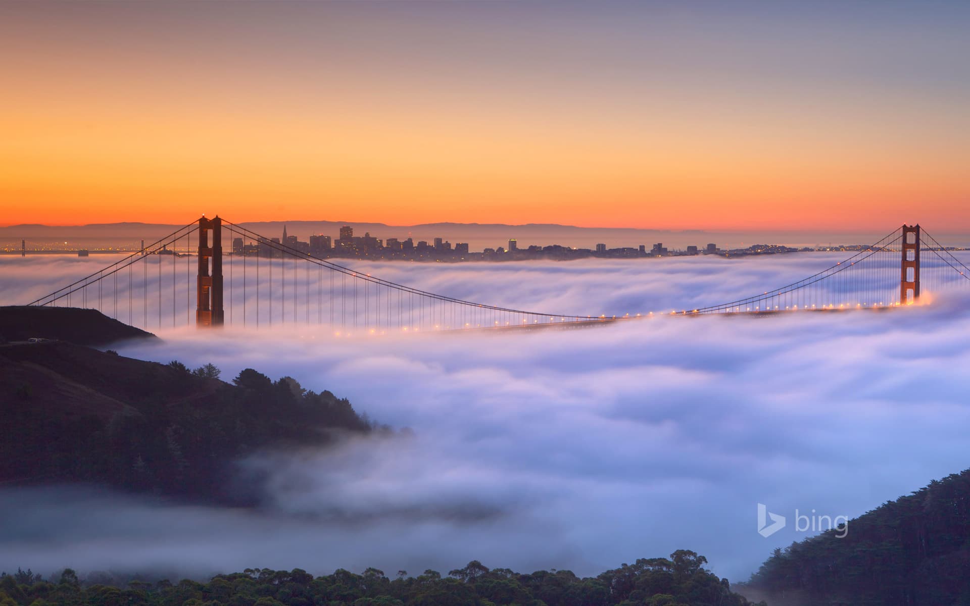 Bing Wallpaper: A fog-shrouded Golden Gate Bridge in San Francisco, California