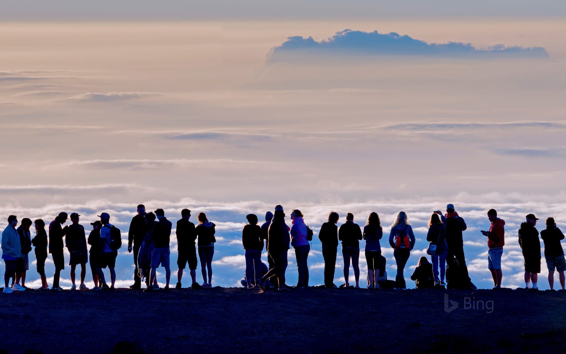 Bing Wallpaper: Visitors at the summit of the Haleakalā Crater in Haleakalā National Park, Hawaii