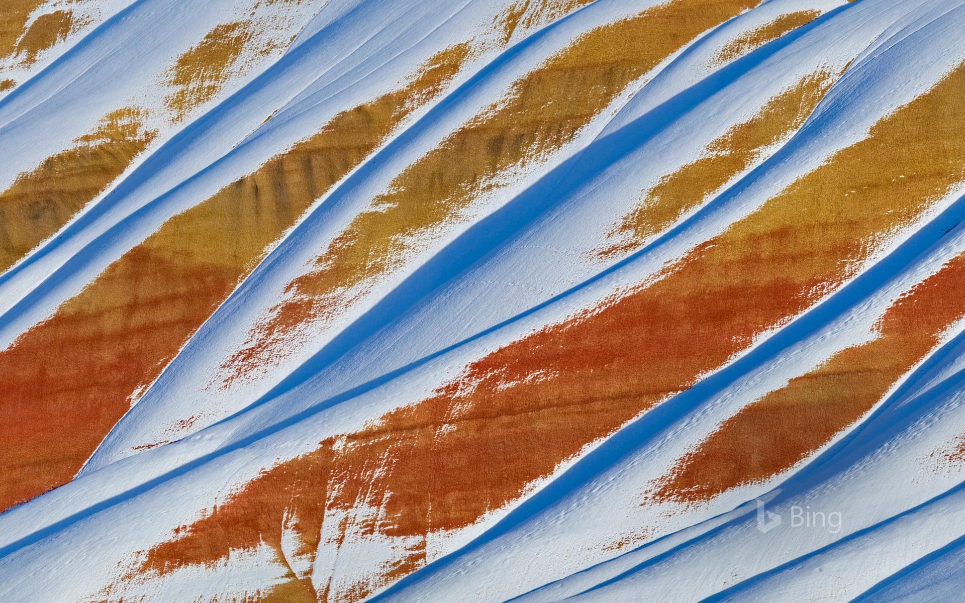 Bing Wallpaper: Snow covering the Painted Hills of John Day Fossil Beds National Monument in Oregon