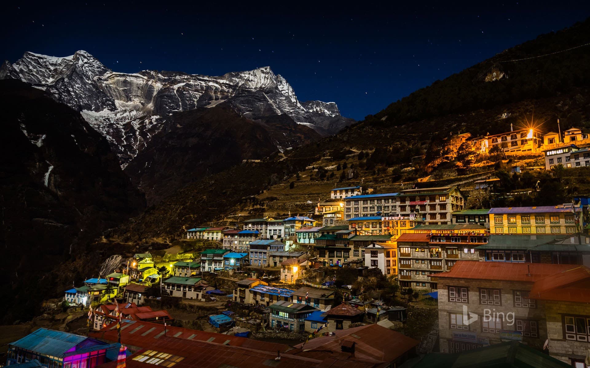 Bing Wallpaper: Kongde Ri mountain looms over Namche Bazaar in Sagarmatha National Park, Nepal
