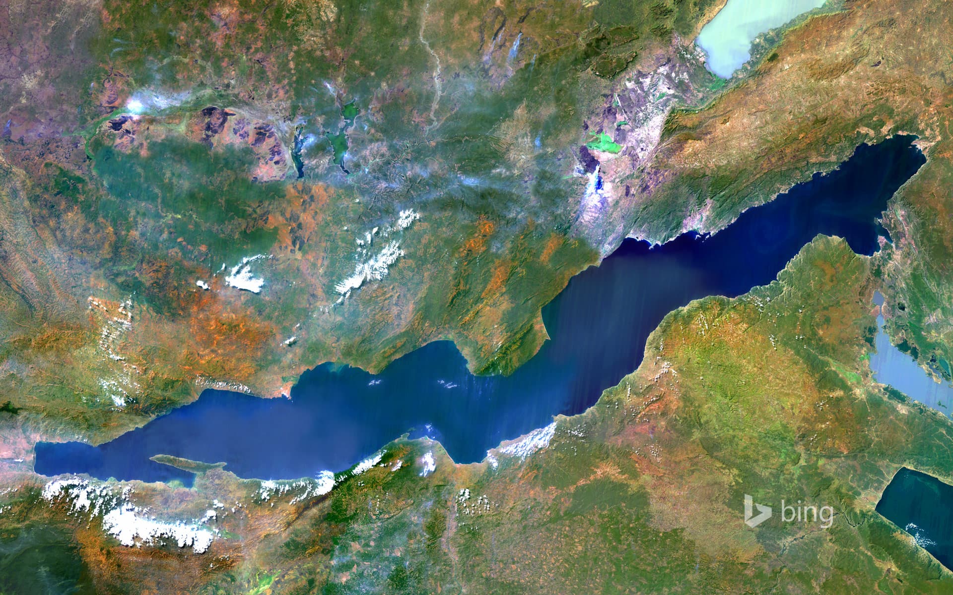 Bing Wallpaper: Lake Tanganyika, an African Great Lake divided between four countries: Burundi, Democratic Republic of the Congo (DRC), Tanzania, and Zambia