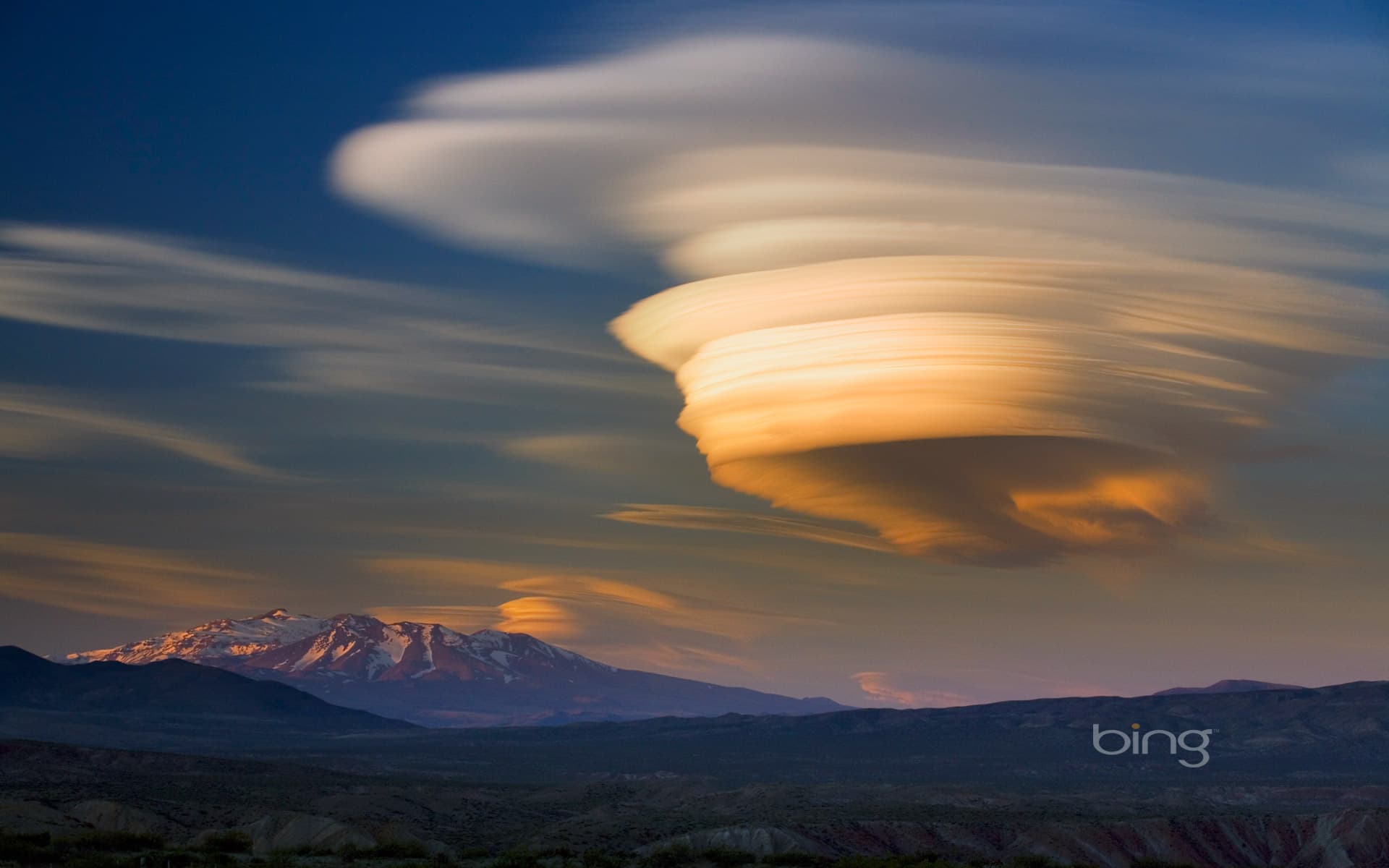 Bing Wallpaper: Lenticular cloud over extinct volcano at sunset, Patagonia, Argentina