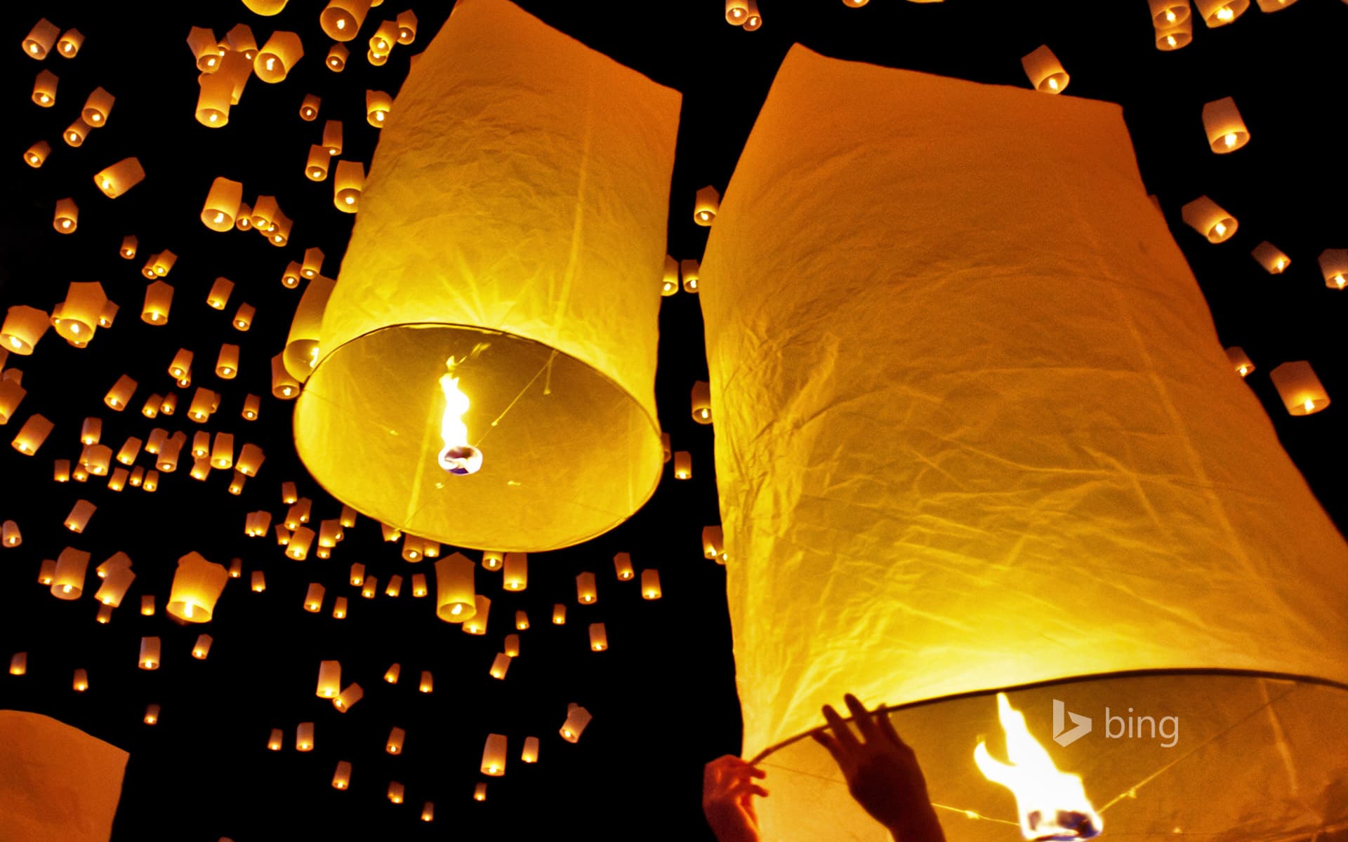 Bing Wallpaper: Fire lanterns released during Loi Krathong in Chiang Mai, Thailand