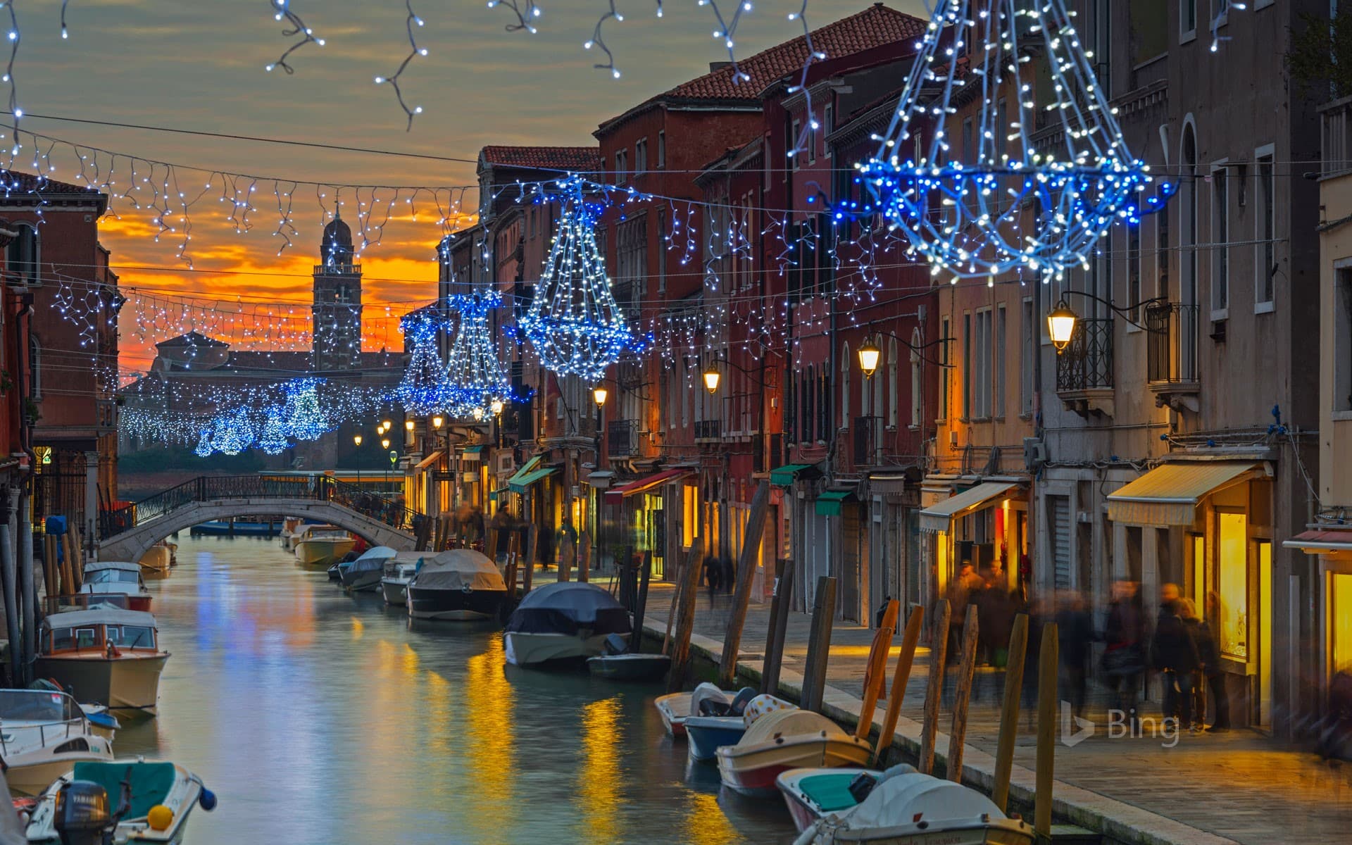 Bing Wallpaper: Holiday decorations on a canal in Murano, Italy