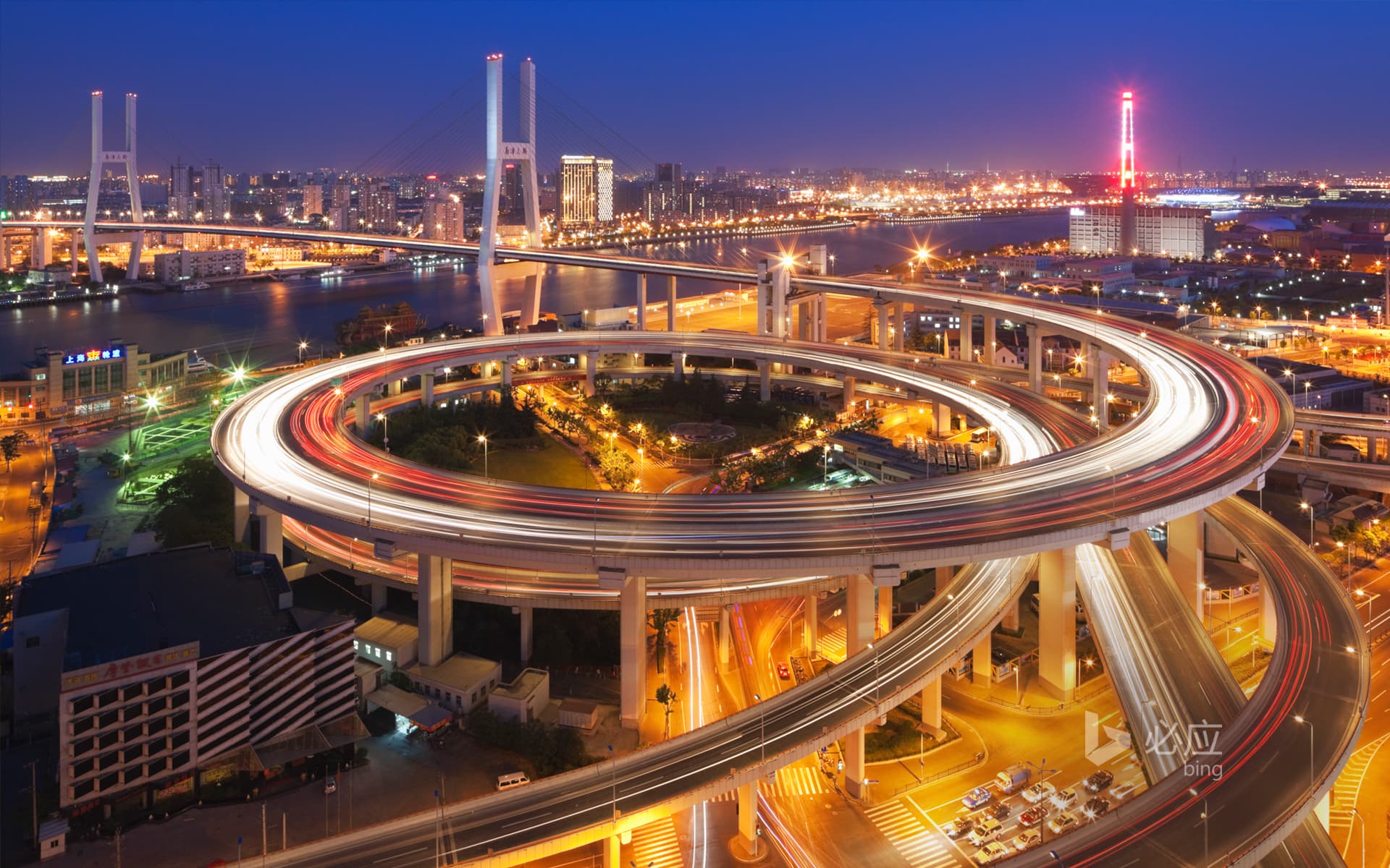 Bing Wallpaper: Dongjiadu in Shanghai at dusk, roundabout leading to Nanpu Bridge