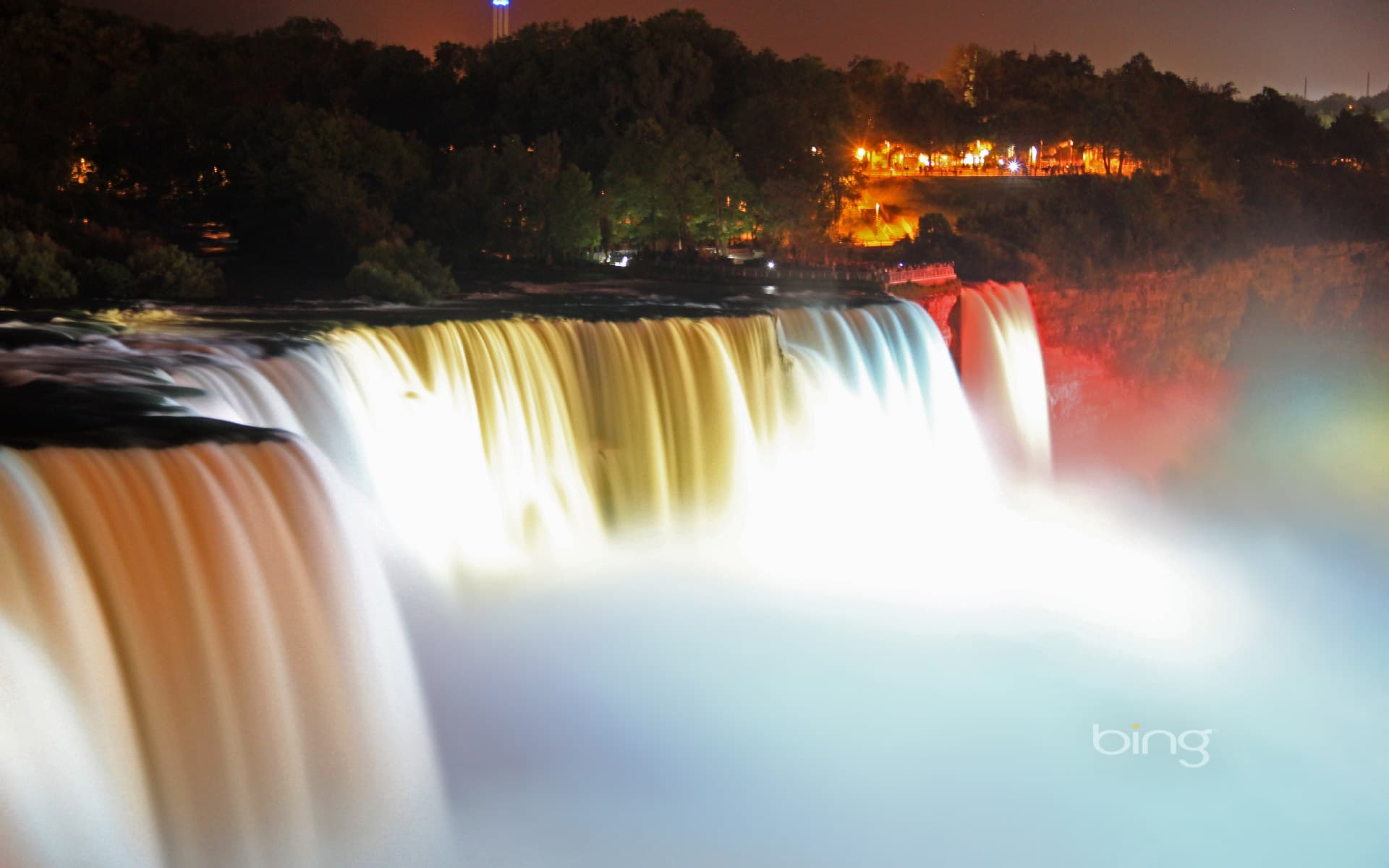 Bing Wallpaper: Illuminated American Falls, part of Niagara Falls, seen from the Prospect Point Park observation tower in Niagara Falls, New York