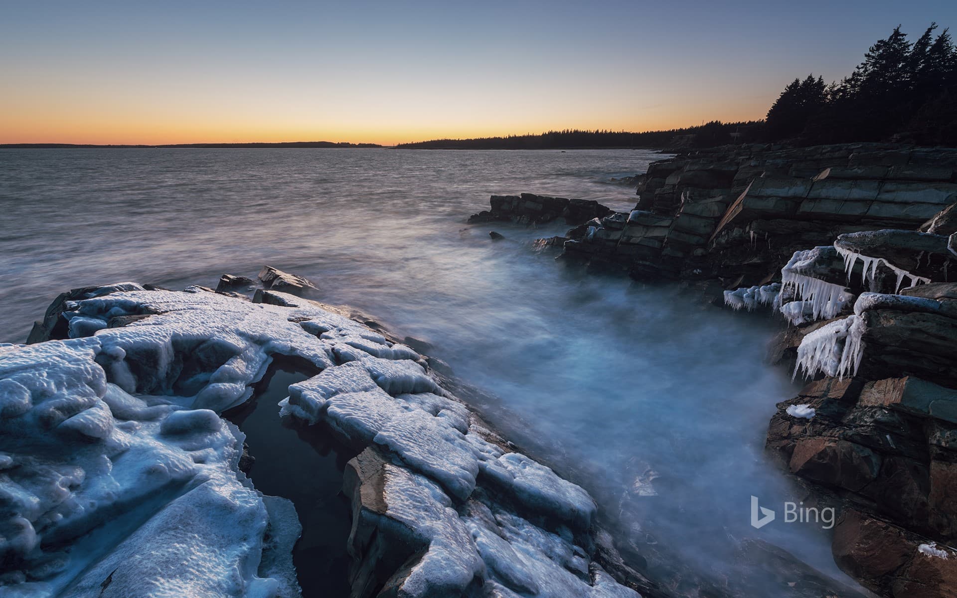 Bing Wallpaper: Thick ice clings to the Atlantic coast of Nova Scotia, Canada