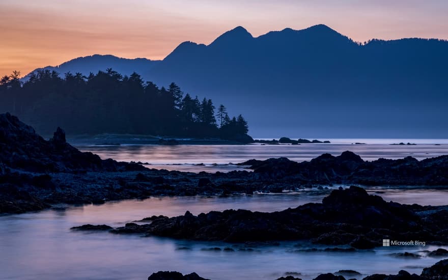 Dusk falls over Vancouver Island viewed from an islet in Nuchatlitz Provincial Park, British Columbia