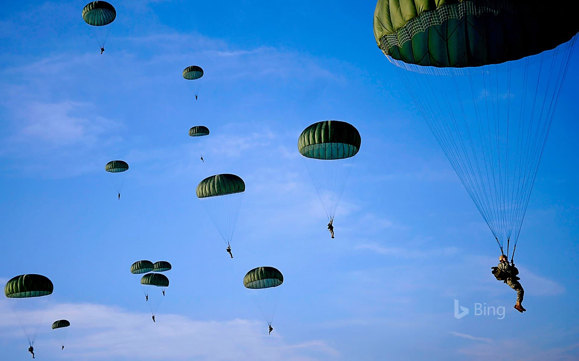 Bing Wallpaper: Paratroopers fill the skies over Fort Bragg in North Carolina, for Operation Toy Drop