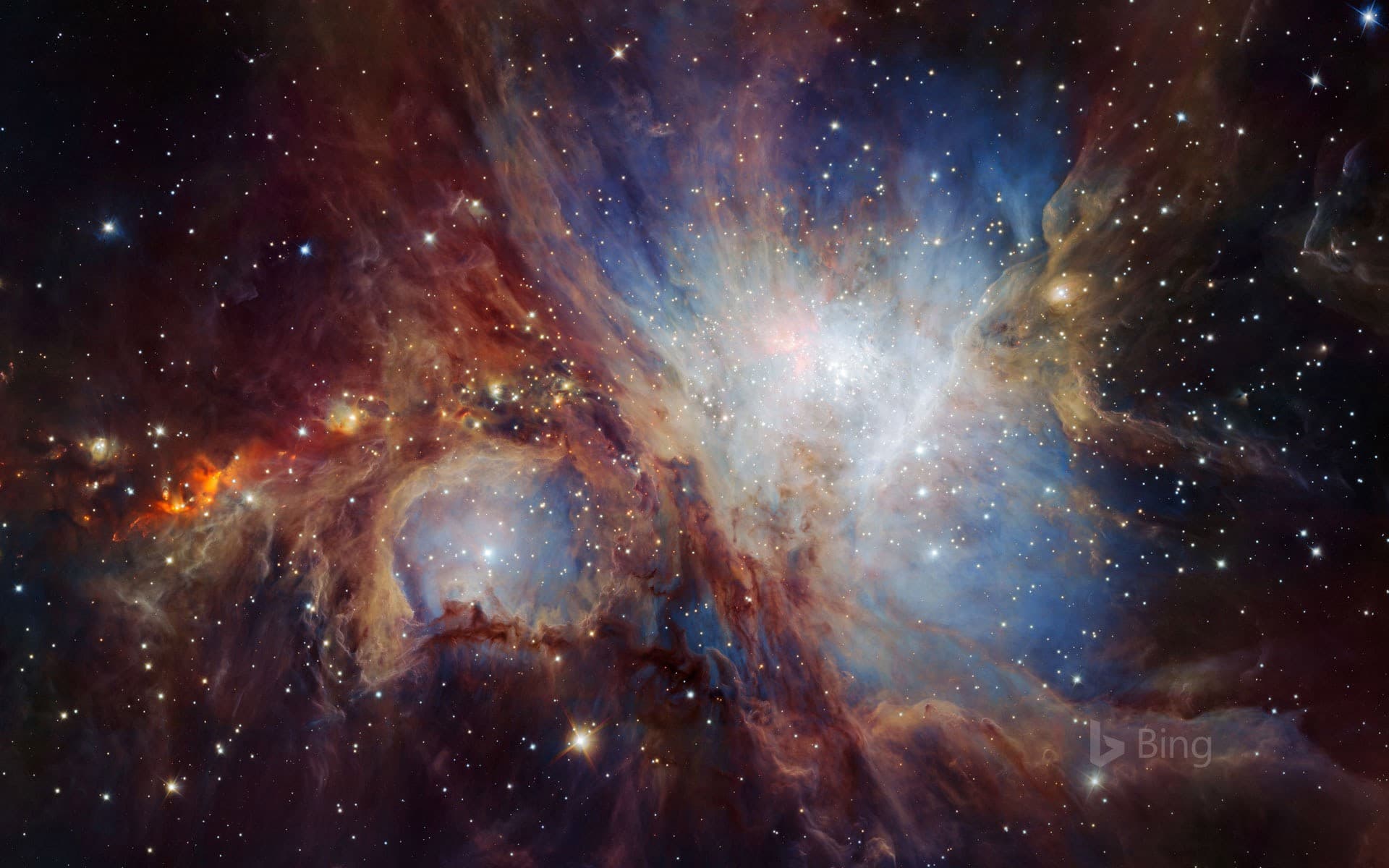 Bing Wallpaper: An infrared image of the Orion Nebula taken from the HAWK-I camera in Chile
