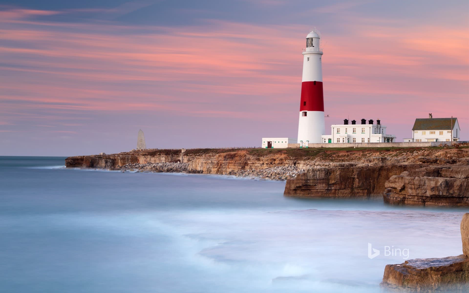 Bing Wallpaper: Dawn sunlight and waves at Portland Bill Lighthouse, Dorset, England
