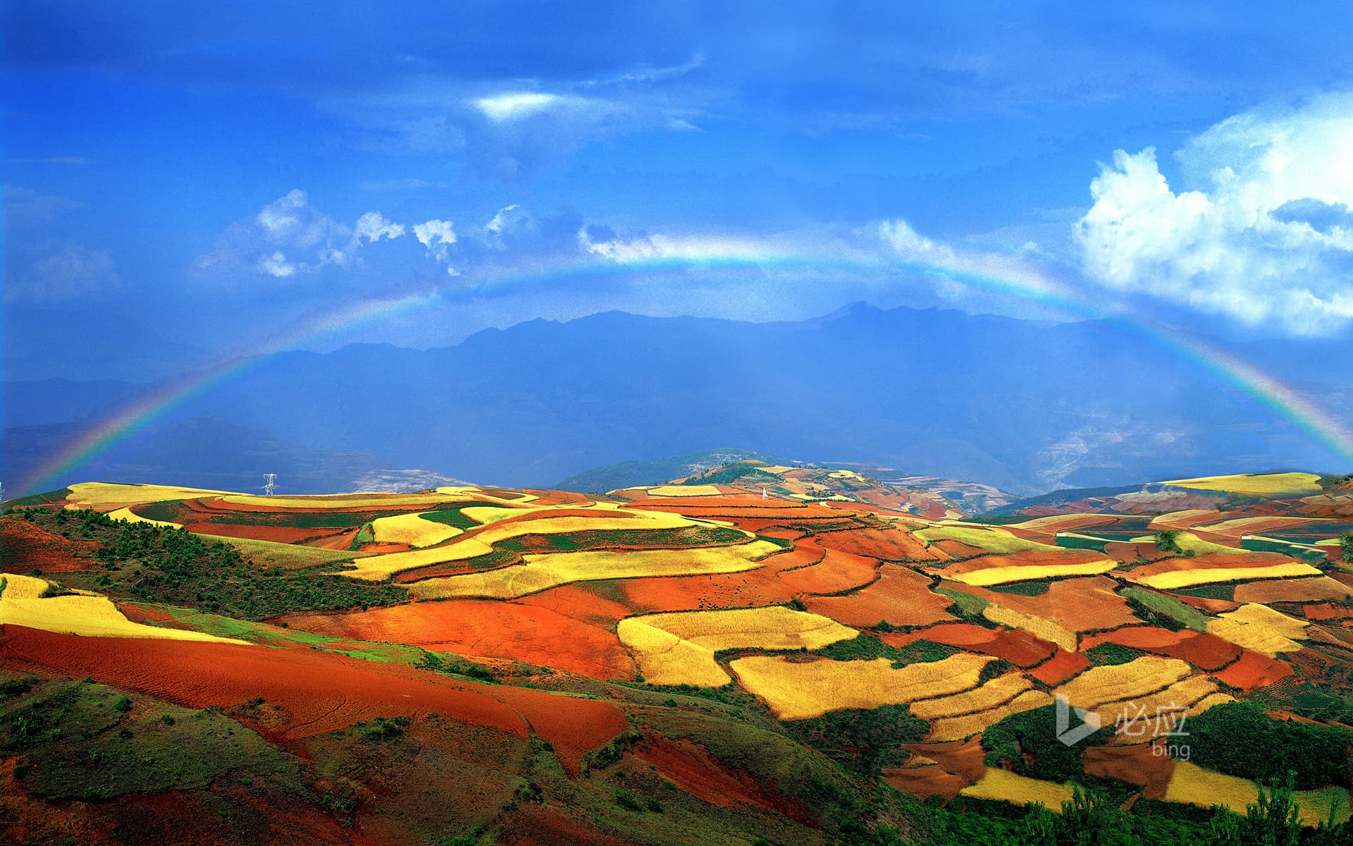 Bing Wallpaper: Rainbow over red land