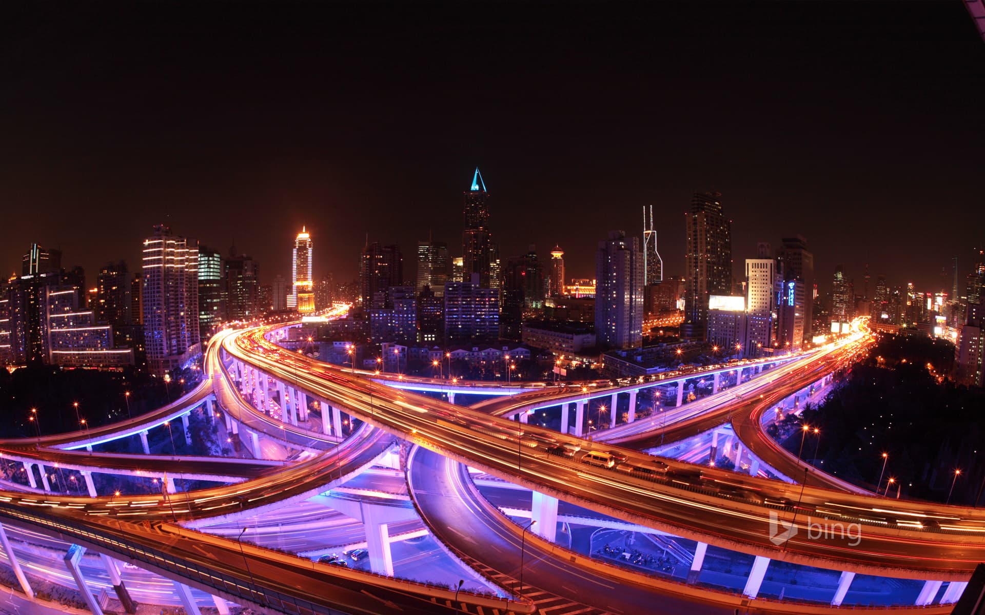 Bing Wallpaper: Shanghai's roadways and skyline lit up at night
