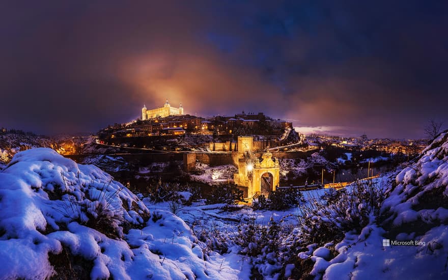 Bing Wallpaper: Lights in Toledo turned on after a snowstorm