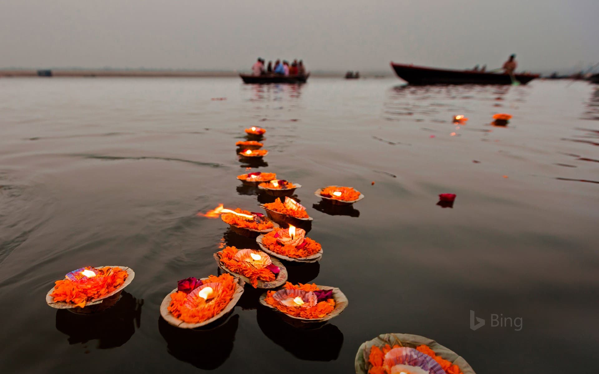 Bing Wallpaper: Candles floating in the Ganges River, Varanasi, India