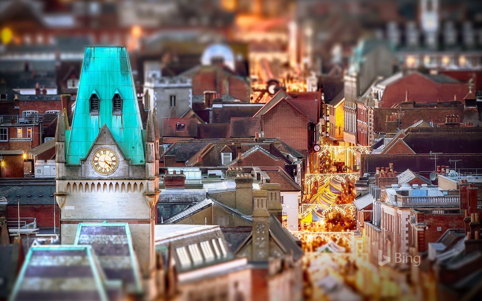Bing Wallpaper: Night-time view of market stalls in Winchester, Hampshire