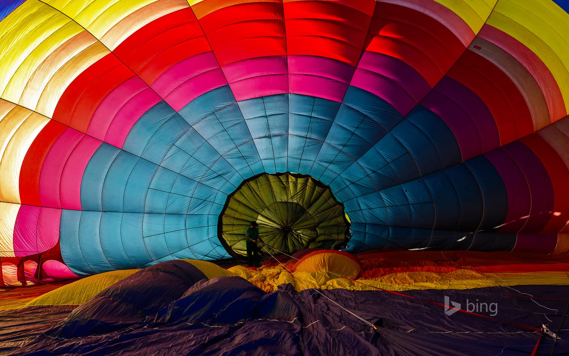 Bing Wallpaper: Hot air balloon inflating for the Winthrop Balloon Festival in Washington State